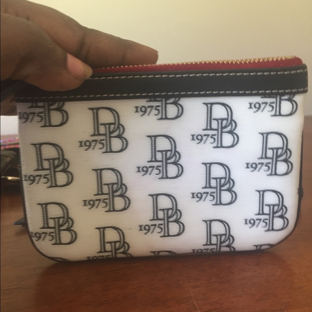 Dooney and bourke 1975 small pouch/ Coin Purse
